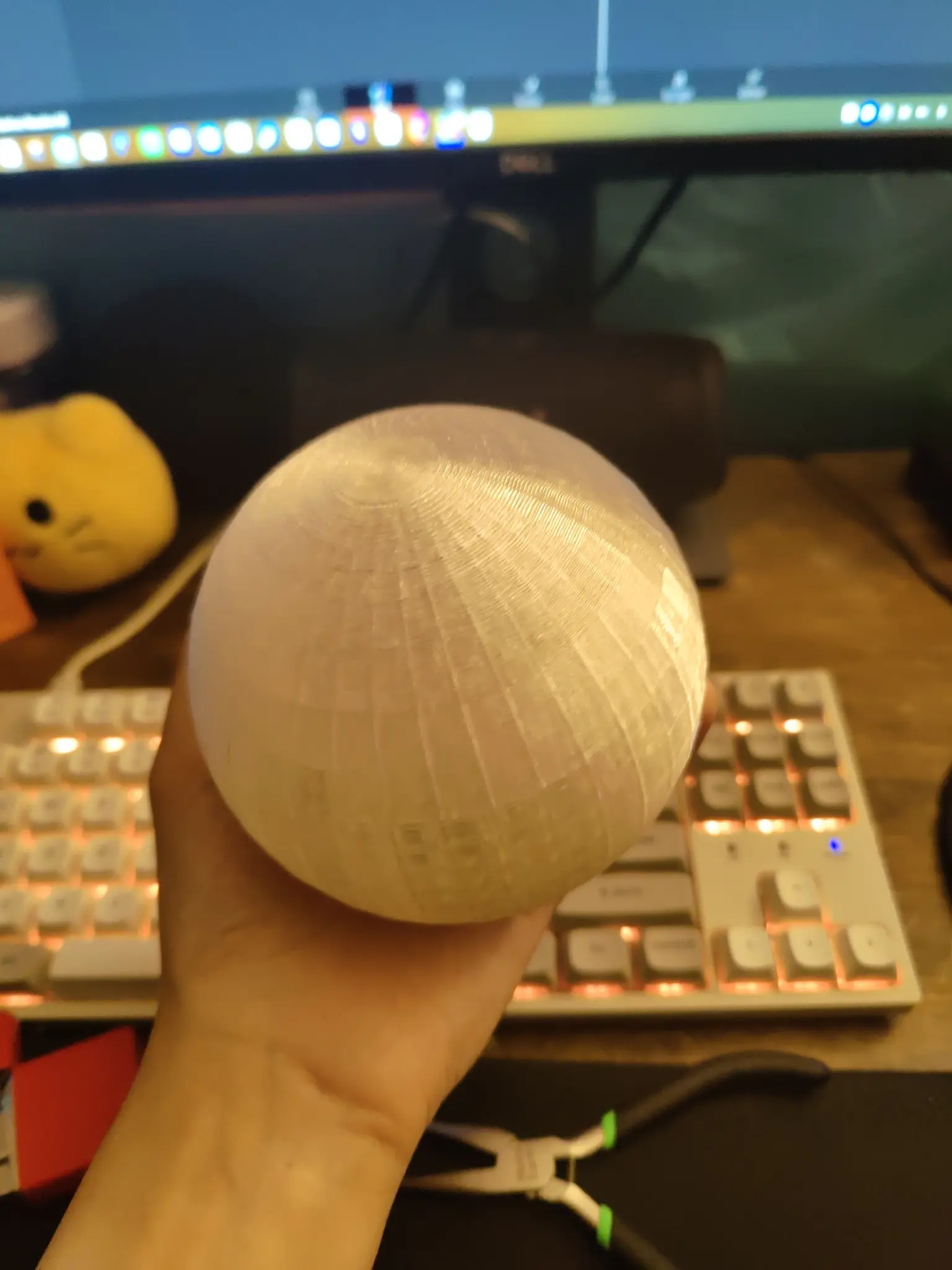 i am holding a 3d printed translucent orb