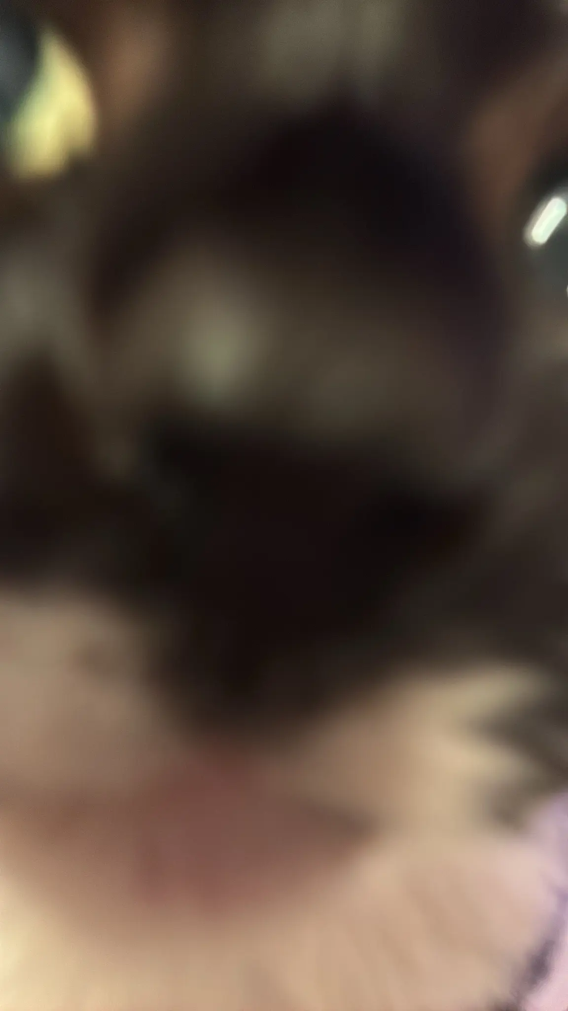 extreme blurry closeup of nias little face