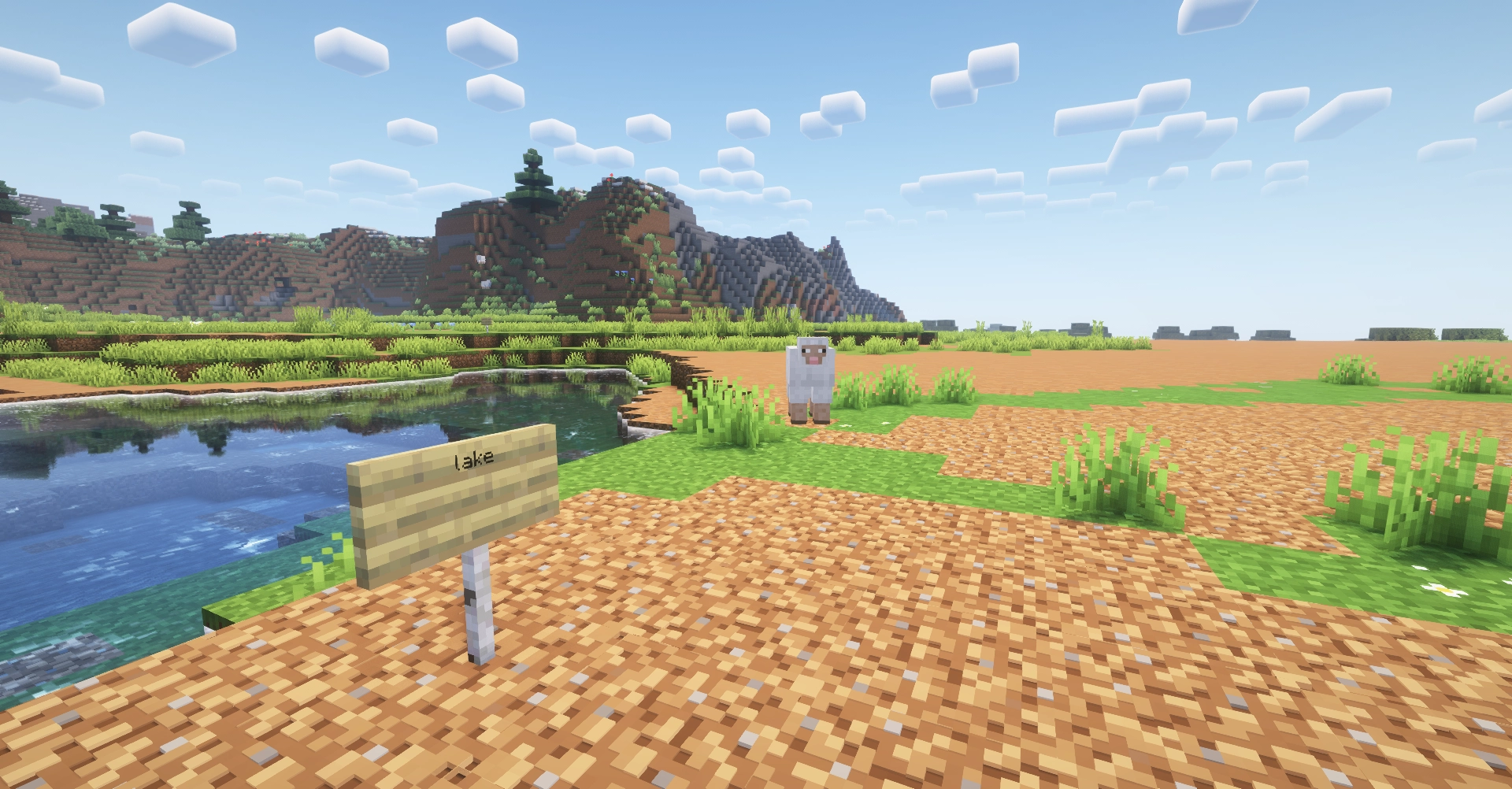 minecraft, there is a lake, with a sign that says "lake", a sheep stares at the camera